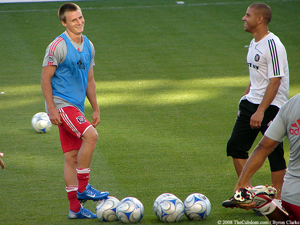 Chris Rolfe laughs with Chris Armas.