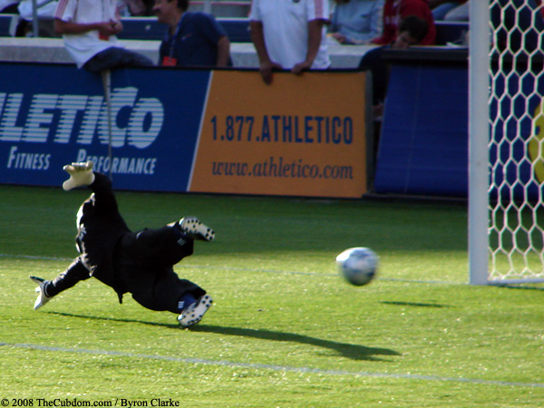 Jon Busch dives for a shot