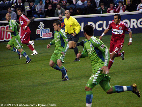 Fire attackers and Sounders defensemen run in transition.